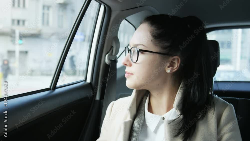 Bored Young Woman Looking Through the Car Window Bored Young Woman Looking Through the Car Window