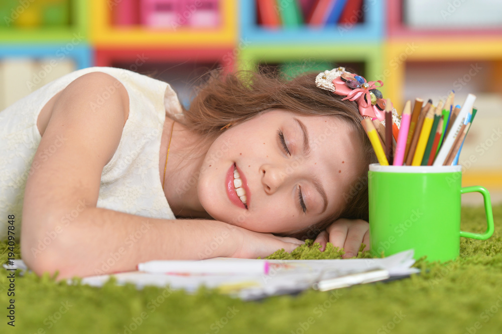 Portrait of cute little girl sleeping on pile Portrait of cute little girl sleeping on pile