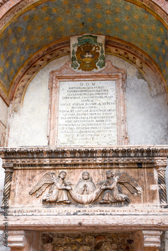 Sarcophagus of the Abati on the external façade of the little church of Sant'Apollinare, Trento, Trentino Alto Adige, Italy photo