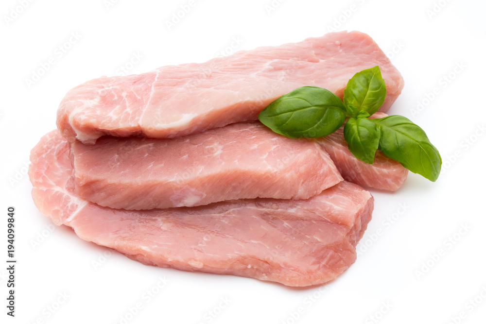 Fresh pork fillet with basil on a white background. Fresh pork fillet with basil on a white background.