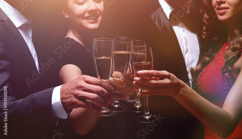 Canvas Print Cheerful people celebrating a sucess with Champagne