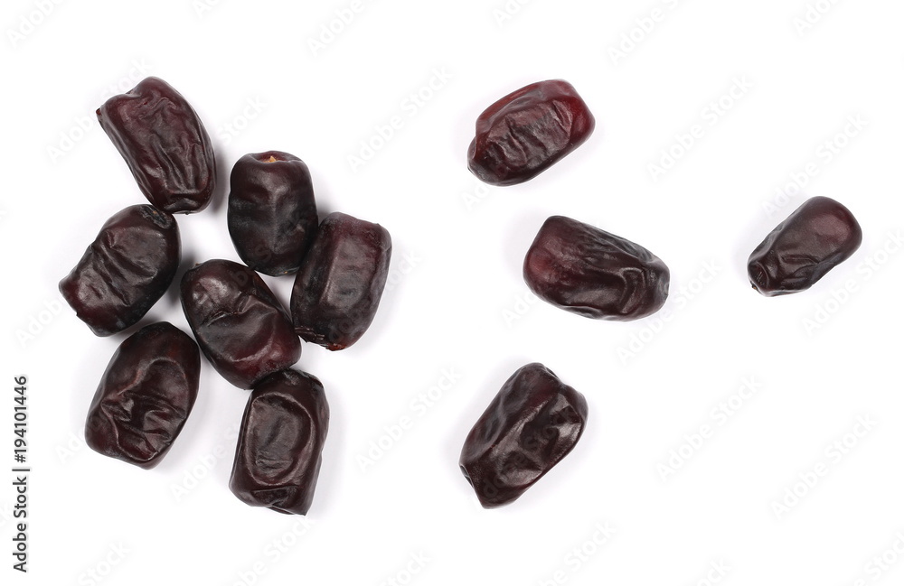 Pile dry dates isolated on white background, sweet fruit, top view Pile dry dates isolated on white background, sweet fruit, top view