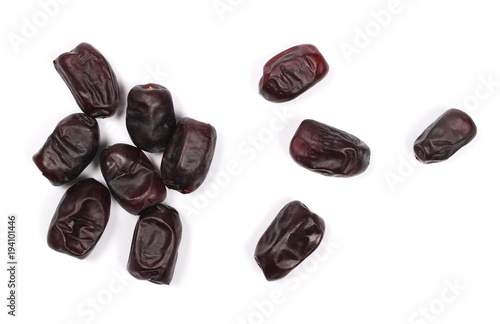 Pile dry dates isolated on white background, sweet fruit, top view