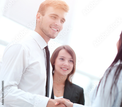 welcome and handshake of business partners in the office.