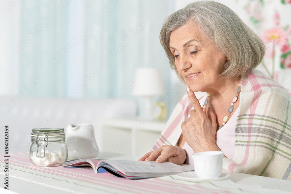 happy aged woman reading magazine happy aged woman reading magazine