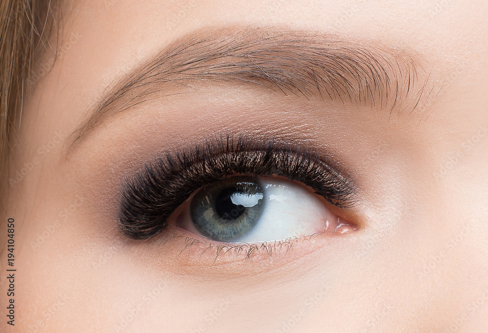 Beautiful Fashion Luxury Makeup, long eyelashes, perfect skin facial make-up. Beauty Brunette model woman holiday make up close up. Eyelash extensions, false eyelashes. Beautiful Fashion Luxury Makeup, long eyelashes, perfect skin facial make-up. Beauty Brunette model woman holiday make up close up. Eyelash extensions, false eyelashes.