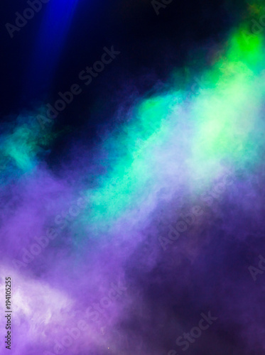 Multi-colored smoke at the concert at night