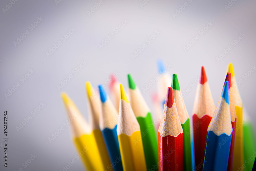 Fototapeta premium Pencils colorul color wooden pencil in metal holder in front of wall background
