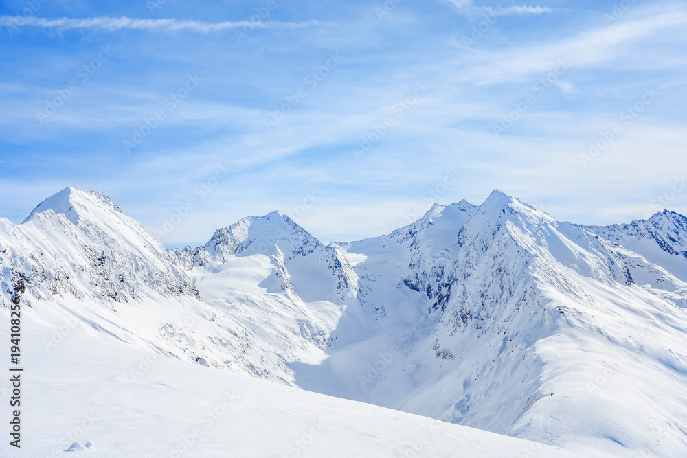 Fototapeta premium Mauntain glacier panoramic snow top panoramic view with blue cloudy sky