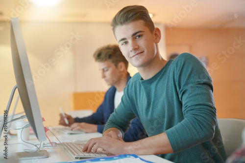 Portrait of smiling student in computing class