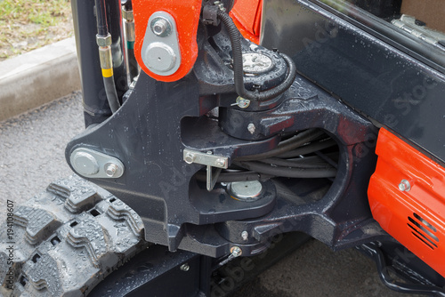 Detail of hydraulic piston excavator arm with articulation joint swivel frame modern tractor