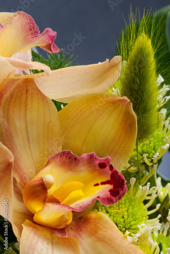 Orange orchid in a bouquet, close-up