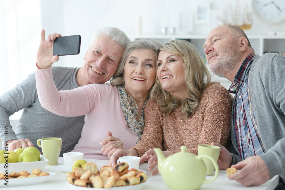 four Senior couples drinking tea four Senior couples drinking tea