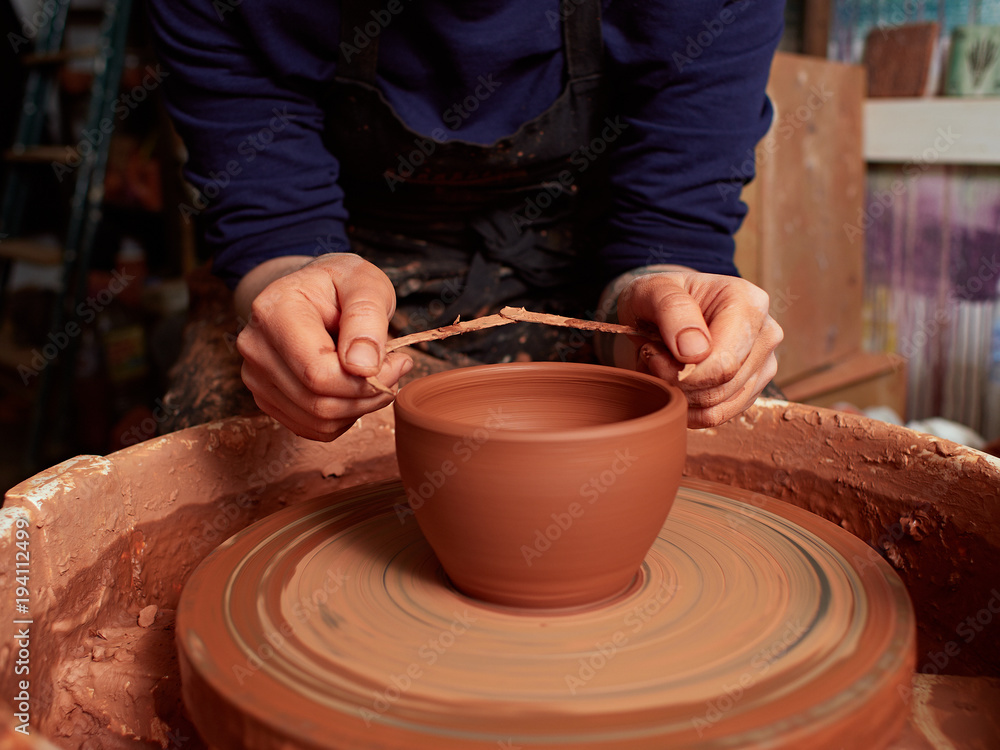 production process of pottery. Checking the Circle with a Caliper. production process of pottery. Checking the Circle with a Caliper.