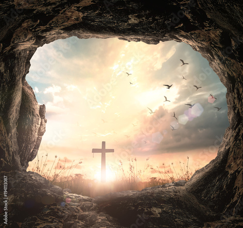 Fotografia Resurrection of Easter Sunday concept: Empty tomb with cross symbol for Jesus Ch