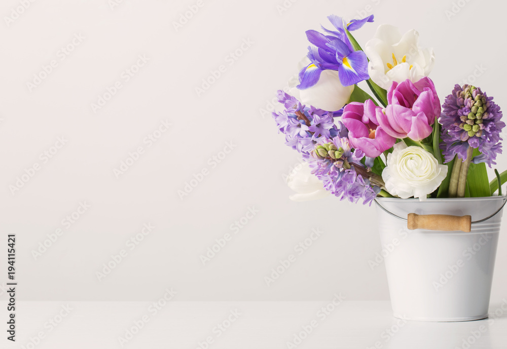 spring flowers in bucket on white  background