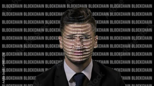 Worried team leader using augmented reality to analyze bitcoin data on a running blockchain black screen background photo