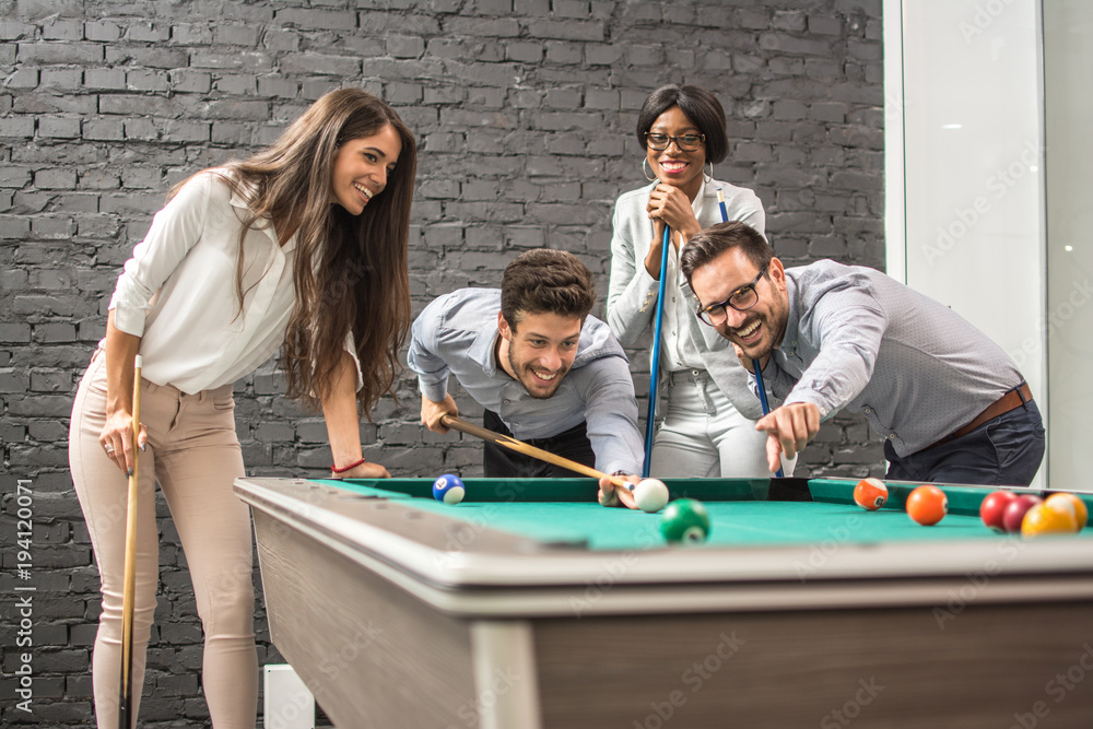 Fototapeta premium Successful cheerful business people playing snooker.