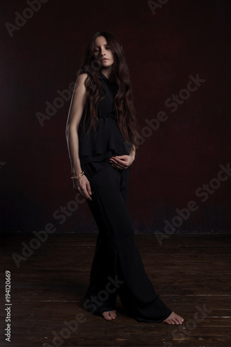 stylish portrait of pregnant woman on dark background