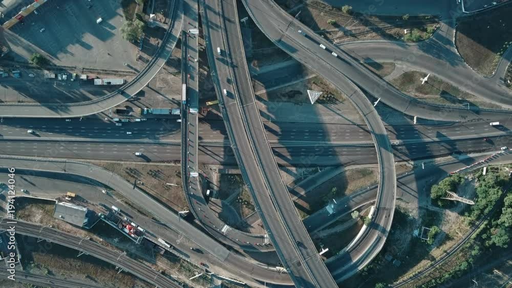 aerial view of a large freeway interchange with cars aerial view of a large freeway interchange with cars