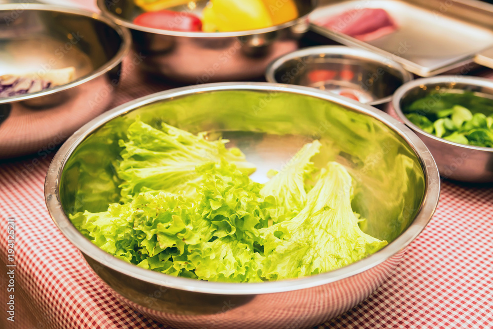 Fresh lettuce in bowl close Fresh lettuce in bowl close