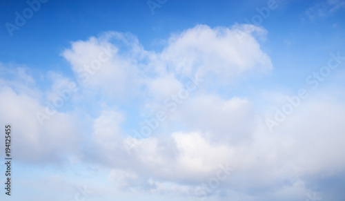 White cumulus clouds in blue sky  background