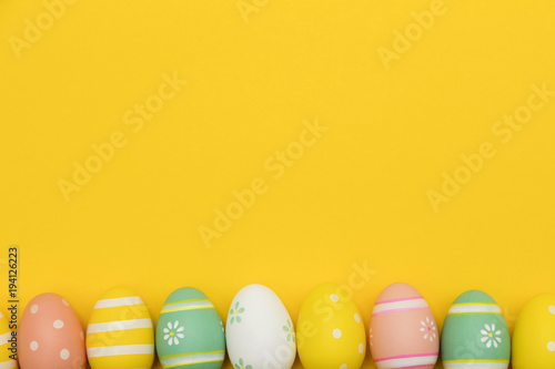 Painted easter eggs on a bright yellow background