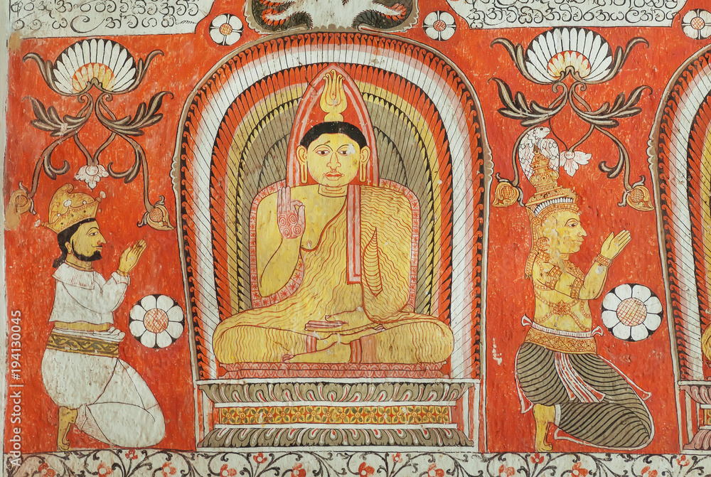 People worshiping Buddha on fresco of the 14th century temple Lankatilaka Vihara with decorated walls. Sri Lanka heritage