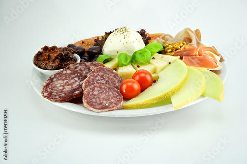 Salami with melon and spice