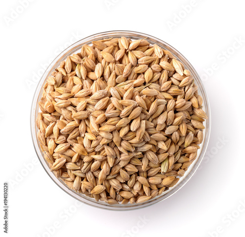 Obraz na płótnie Top view of barley seeds in glass bowl