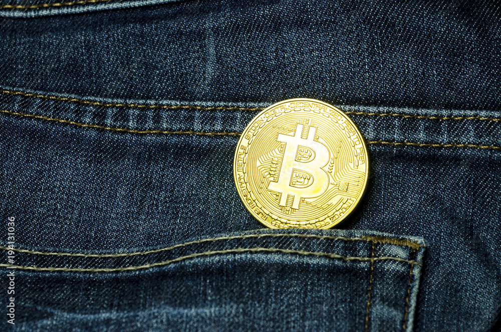 Bit coin in the pocket of blue jeans Bit coin in the pocket of blue jeans