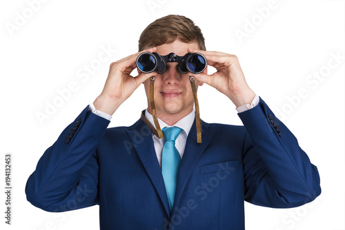 Businessman looking binoculars, blue suit isolated over white background.