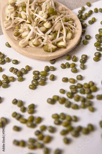 Healthy food. Green beans. Fresh sprouts. Wooden spoon photo