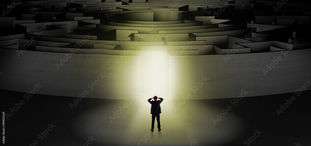 Businessman starting a concentric labyrinth