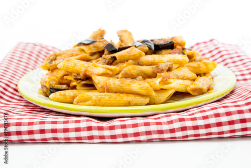 pasta with aubergine and tomato sauce on a the table