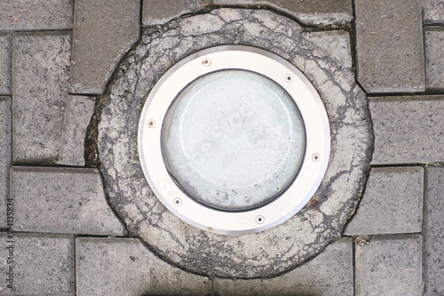 Gray tiles. Round lantern on the ground