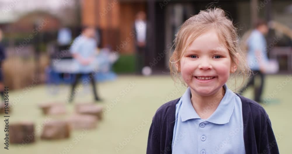 4k, Portrait of a happy and cheerful little girl at a school playground. Slow motion. 4k, Portrait of a happy and cheerful little girl at a school playground. Slow motion.