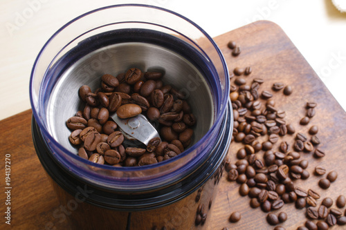 coffee beans in an electric coffee grinder