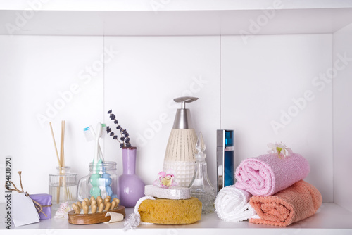 Various spa and beauty threatment products on white shelf