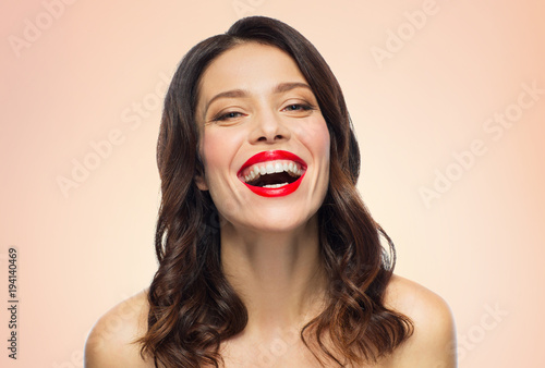 beautiful laughing young woman with red lipstick