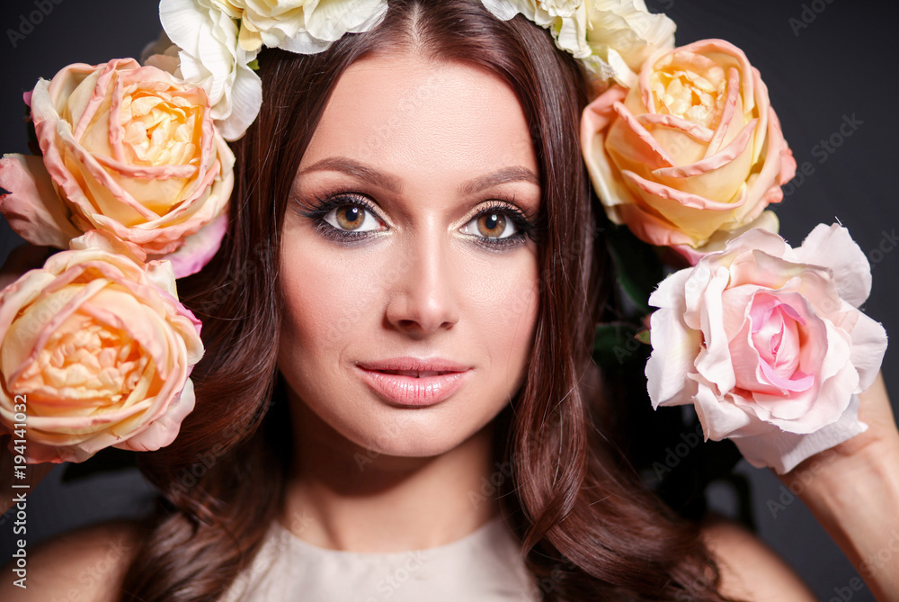 Portrait of a beautiful woman with flowers in her hair Portrait of a beautiful woman with flowers in her hair