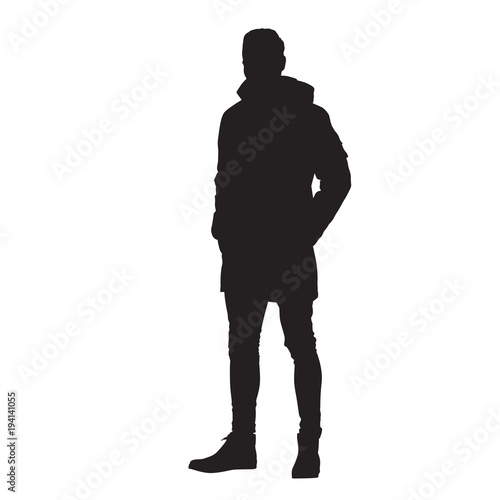Man standing in winter jacket with hands in his pockets, isoalted vector silhouette