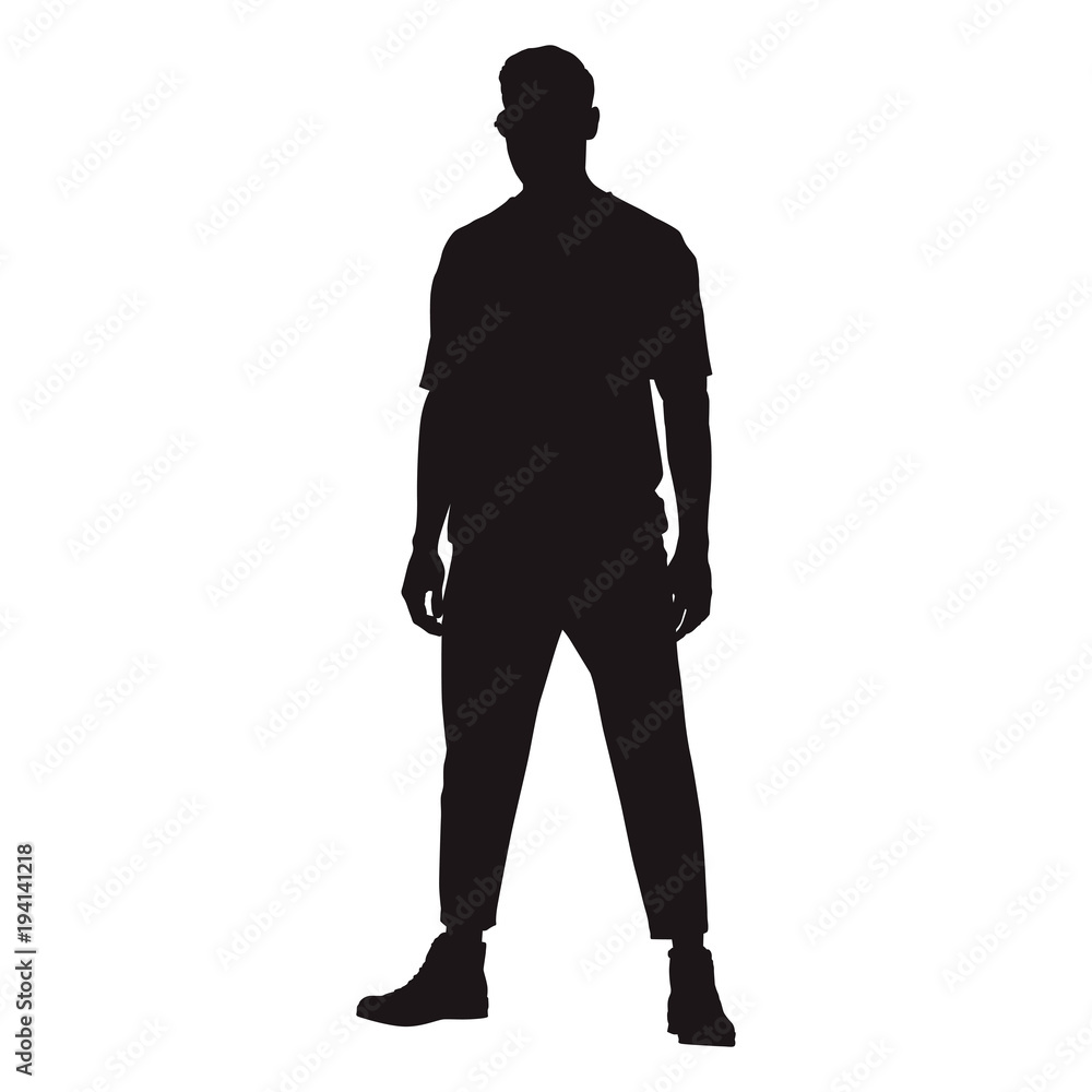 Man standing confidently facing forward with his legs crooked, isolated vector silhouette