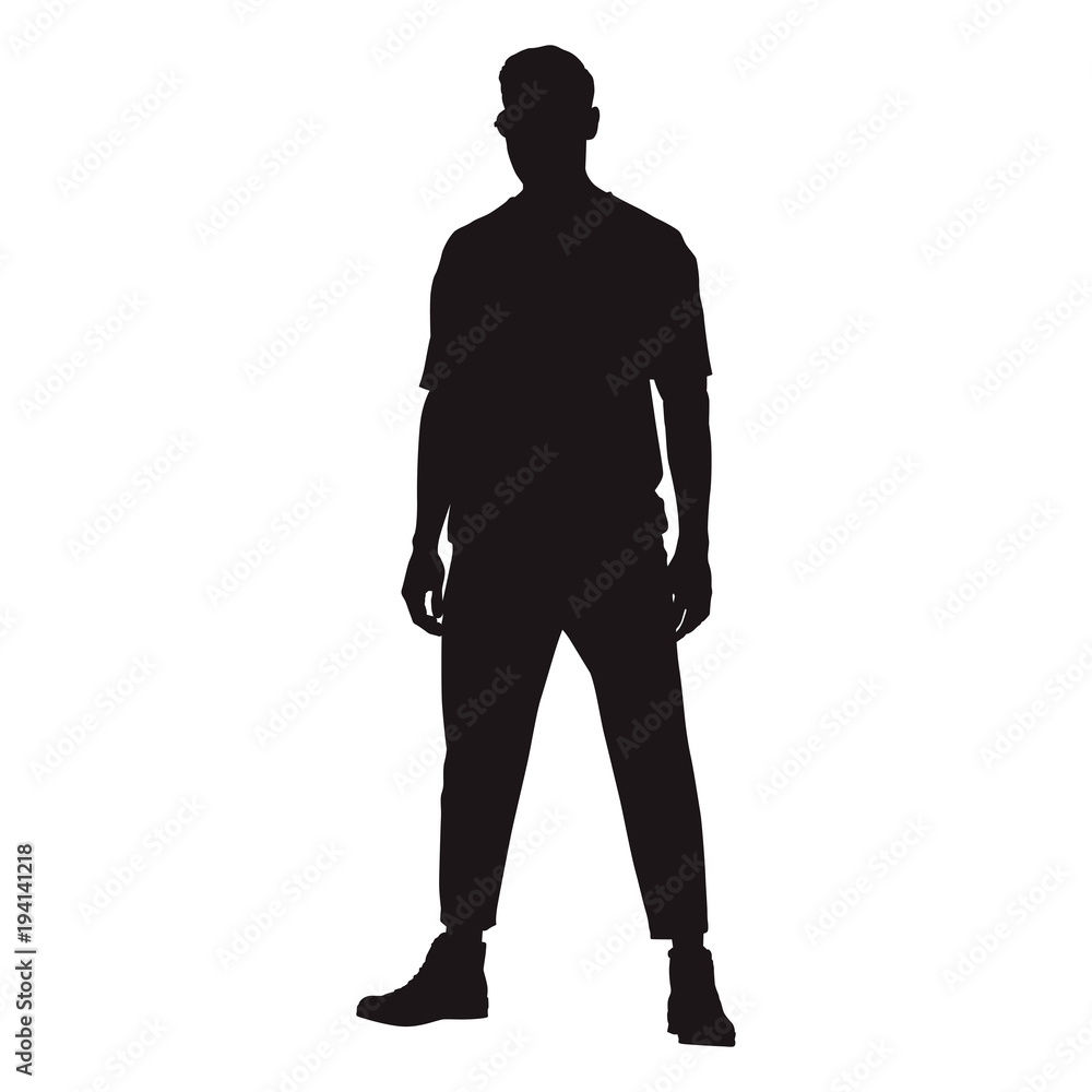 Fototapeta premium Man standing confidently facing forward with his legs crooked, isolated vector silhouette