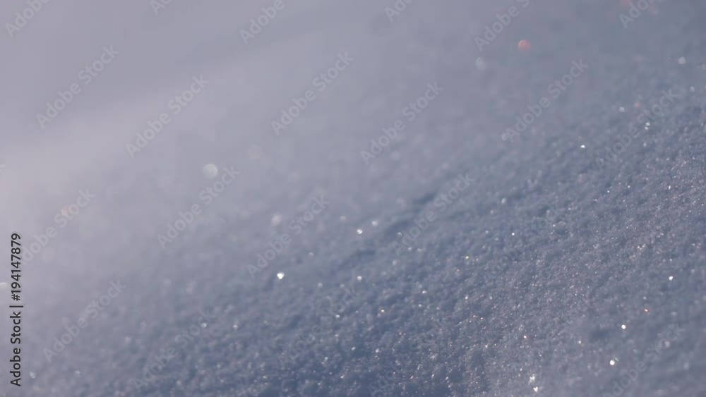 Snowdrift with front-focus close up. Winter lyric scene with glittering snowflakes in slow motion. Sparkling snowy macro background.
Snowdrift with front-focus close up. Winter lyric scene with glittering snowflakes in slow motion. Sparkling snowy macro background.