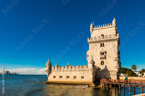 The iconic quarter facade of the Tower of Belem (Torre de So Vicente)  on the bank of the Tagus River. © Debu55y