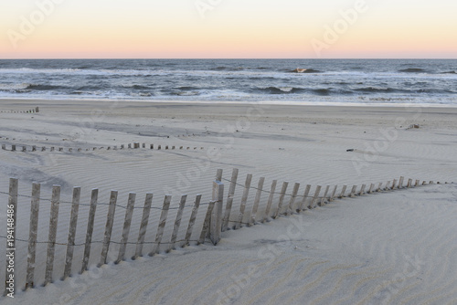 Sand Dune Fences on Beach at Sunset