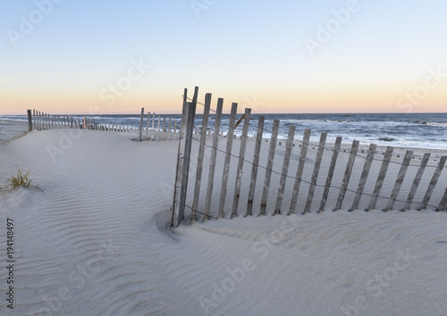 Fototapeta Naklejka Na Ścianę i Meble -  Beach Dune Fences at Sunset