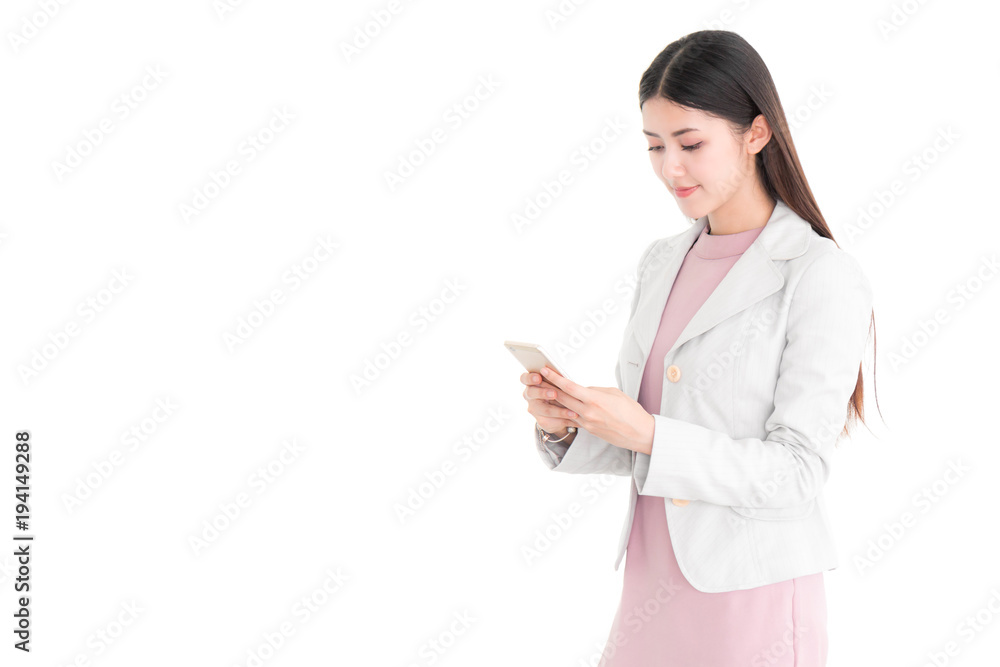 Portrait of a Attractive young Asian confident businesswoman wearing a suit with smiling, happy face and using a smartphone isolated on white background. Portrait of a Attractive young Asian confident businesswoman wearing a suit with smiling, happy face and using a smartphone isolated on white background.