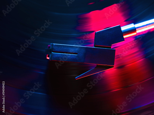 Cinemagraph, retro record vinyl player. Record on turntable. Top view close up. Loop-able Vintage photo of Old Gramophone, playing a music. Neon light